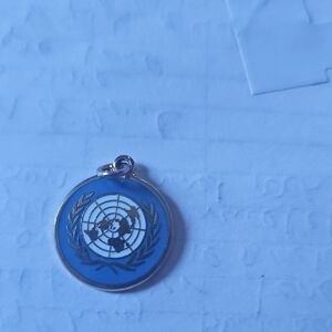 Untied Nations Blue and Silver Pendant Charm